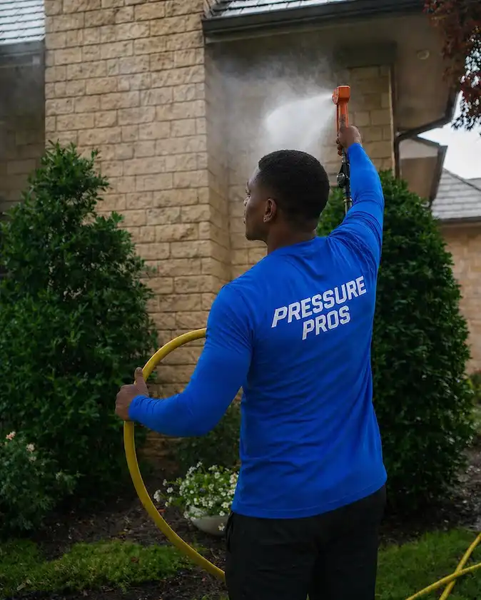 House washing service for residential exterior surfaces