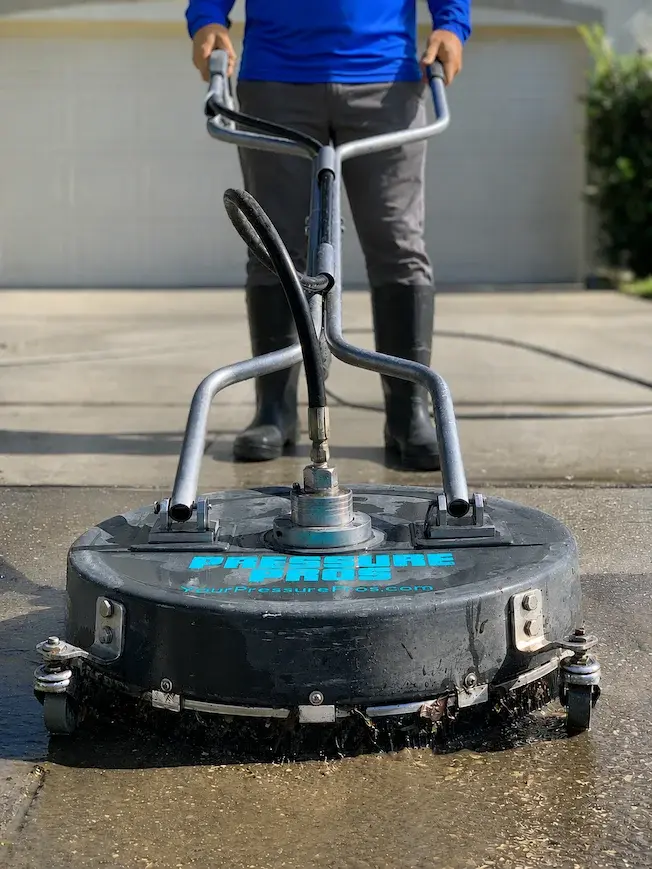 Pressure Pros surface cleaner washing a residential driveway in Orlando